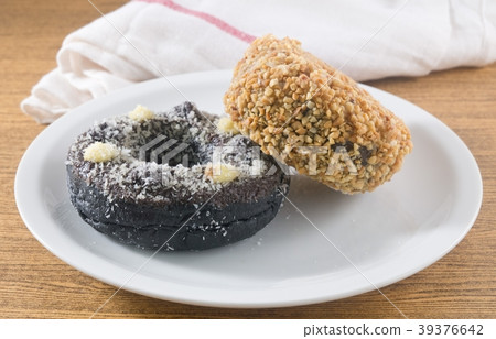 Dish of Fresh Chocolate Donut and Peanuts Donut 39376642