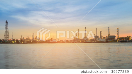 Panorama sunrise over oil refinery river front 39377289