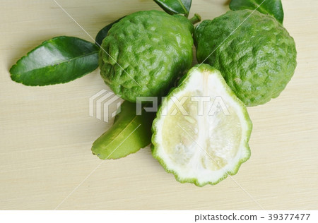 Bergamot fruit with leaf on wooden board 39377477