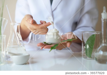 scientist hand pour,drop oil or serum laboratory 39377820