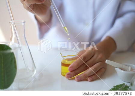 scientist hand pour,drop oil or serum laboratory scientist hand pour,drop oil or serum laboratory 39377878