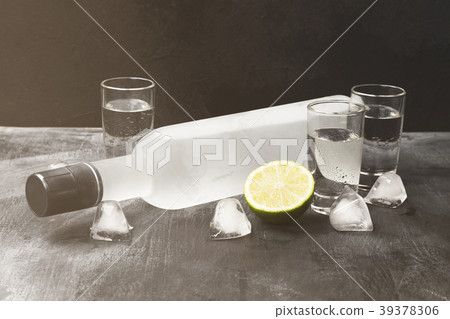 Cold vodka in shot glasses on a black background 39378306