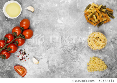 Various raw pasta and ingredients for cooking Various raw pasta and ingredients for cooking 39378313