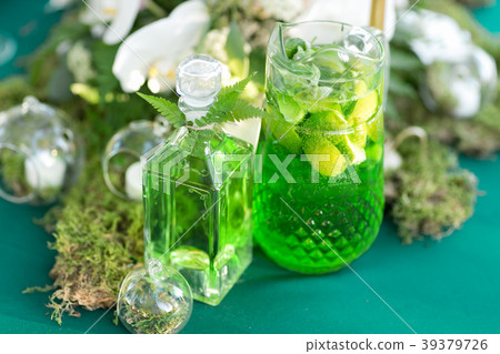 forest decor. Lemonade pitcher with lime, mint and forest decor. Lemonade pitcher with lime, mint and 39379726