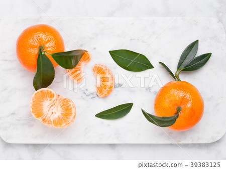 Glass bottle of fresh mandarin tangerines juice Glass bottle of fresh mandarin tangerines juice 39383125