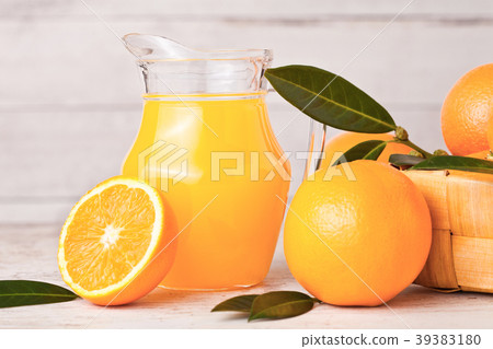 Glass jar of raw organic fresh orange juice 39383180