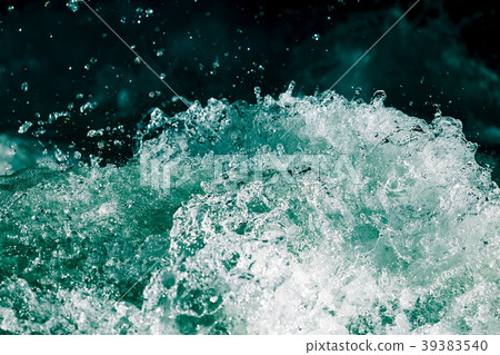 Splash of stormy water in the ocean on a black 39383540