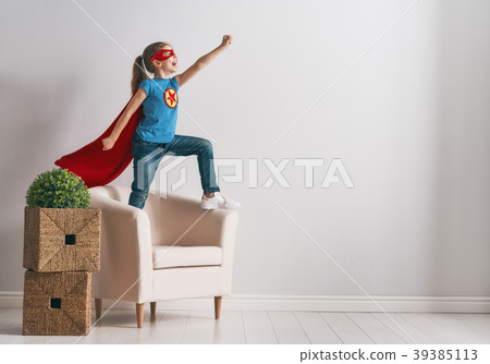 child is playing superhero child is playing superhero 39385113