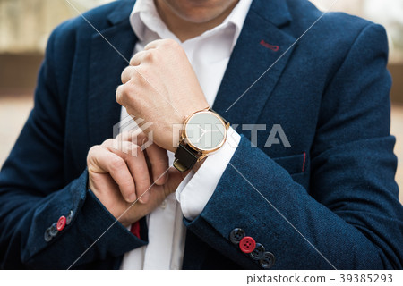 Elegant man in blue suit, business man's hand with 39385293