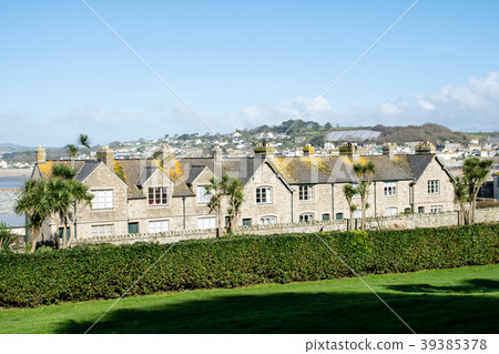 A beautiful lawn and a stone tenement seen behind a hedge At St Michael's Mount A beautiful lawn and a stone tenement seen behind a hedge At St Michael's Mount 39385378