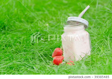 Mug of yogurt and strawberry 39385485