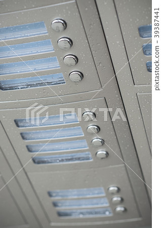 rain drops on modern intercom on new building  39387441