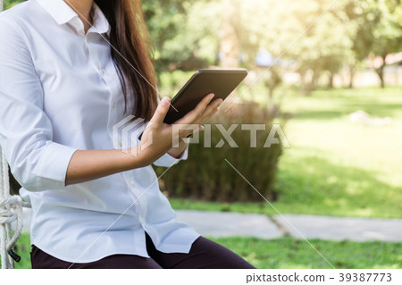Work and relax, Woman freelancer is working on digital tablet, w 39387773