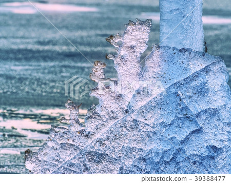 Broken floes and  iceberg. A large ice piece 39388477