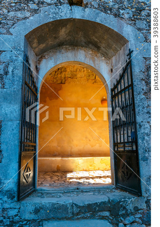 Sunlight shining through the gate in old building Sunlight shining through the gate in old building 39388603