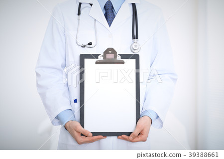 Unknown male doctor standing straight while 39388661