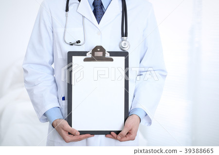 Unknown male doctor standing straight while 39388665
