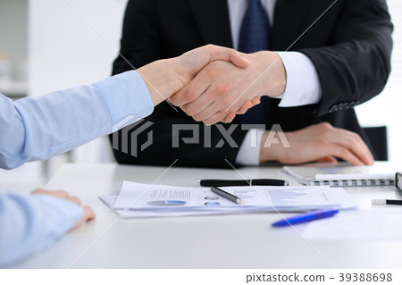 Close Up of unknown business people shaking hands Close Up of unknown business people shaking hands 39388698