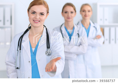 Group of medicine doctors offering helping hand Group of medicine doctors offering helping hand 39388737