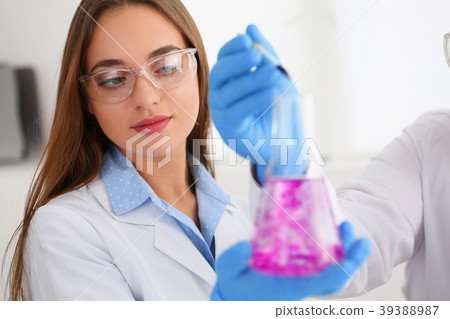 Technician hold in arms in protective gloves Technician hold in arms in protective gloves 39388987