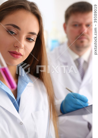 Technician hold in arms in protective gloves Technician hold in arms in protective gloves 39389019