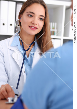 Beautiful female doctor make medic procedure 39389139