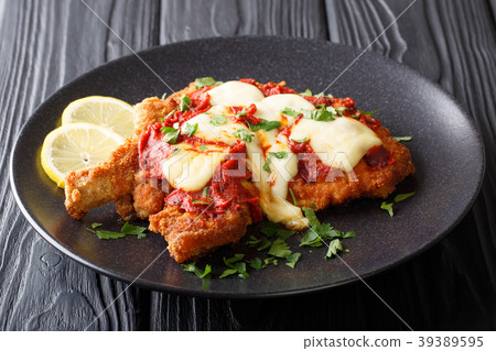 Delicious veal cutlet with mozzarella cheese 39389595