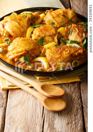 Spicy chicken stew with salted lemons, onions 39389691