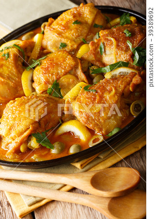 Stewed chicken with salted lemons, onions Stewed chicken with salted lemons, onions 39389692