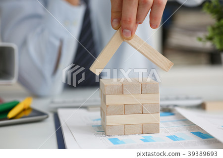 Male hand holds the roof to the lock in Male hand holds the roof to the lock in 39389693