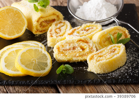 lemon roll cake with mint and powdered sugar lemon roll cake with mint and powdered sugar 39389706