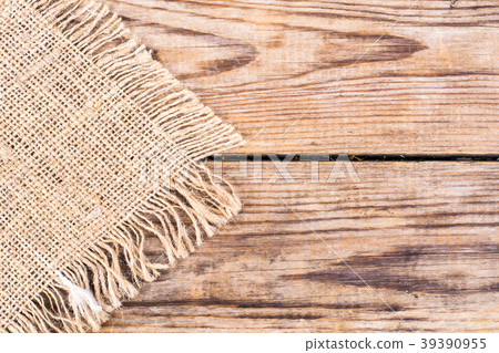 Sackcloth texture on wooden table Sackcloth texture on wooden table 39390955