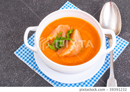 Carrot, pumpkin cream soup with salmon 39391232