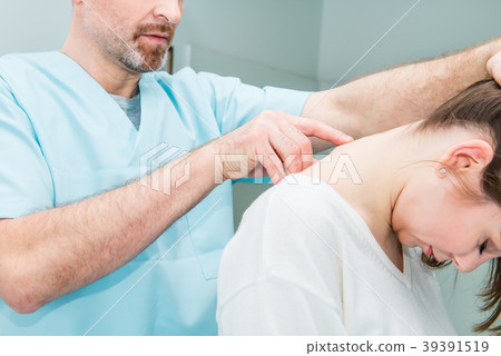 neurologist doctor examines cervical vertebrae neurologist doctor examines cervical vertebrae 39391519