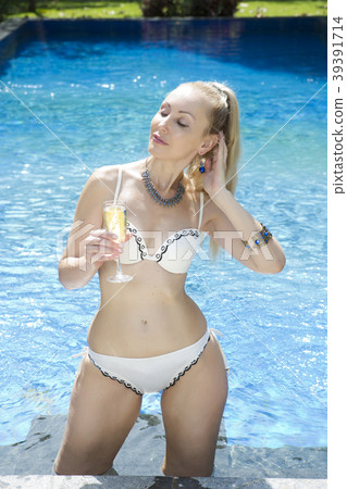 beautiful woman with a long fair hair with a slim  39391714