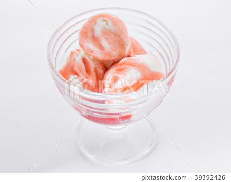 Vanilla ice cream with strawberry syrup on white Vanilla ice cream with strawberry syrup on white 39392426