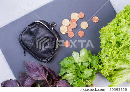 Fresh vegetables, purse and coins. 39393536