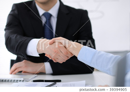 Close Up of unknown business people shaking hands Close Up of unknown business people shaking hands 39394905