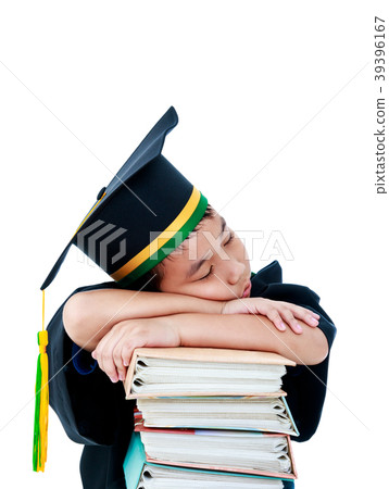 Child in graduation gown with many books. Isolated 39396167