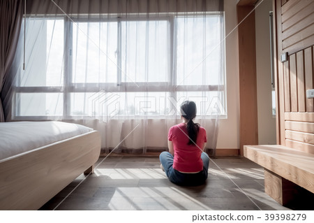 woman sit and look somewhere in the room woman sit and look somewhere in the room 39398279