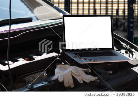 Mechanic repairing a car  in garage  Auto repair 39398926