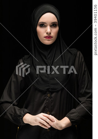Beautiful young muslim woman wearing black hijab Beautiful young muslim woman wearing black hijab 39401156