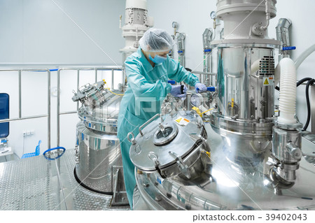 Pharmaceutical factory woman worker in protective 39402043