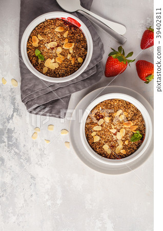 Homemade summer breakfast strawberry crumble. 39402811