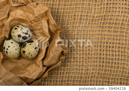 Quail Eggs on Burlap Background 39404216