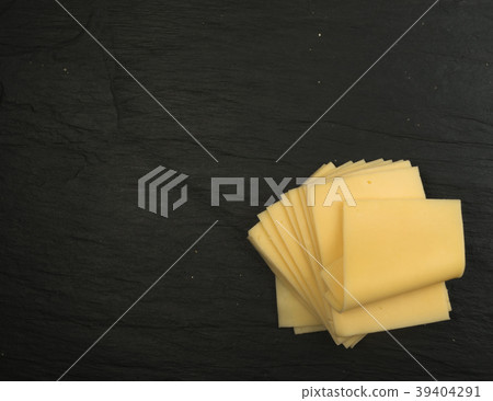 Sliced Cheese Over Stone Background Sliced Cheese Over Stone Background 39404291