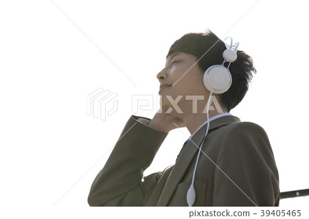 Male student listening to music on the roof Male student listening to music on the roof 39405465