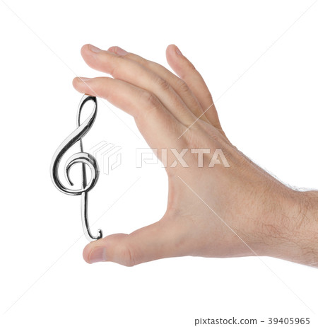 Hand holding a treble clef Hand holding a treble clef 39405965