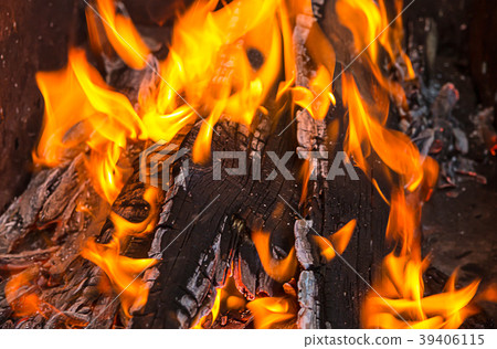 orange flame pierces the burnt boards bright orange flame pierces the burnt boards bright 39406115
