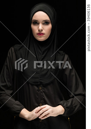 Beautiful young muslim woman wearing black hijab Beautiful young muslim woman wearing black hijab 39406136